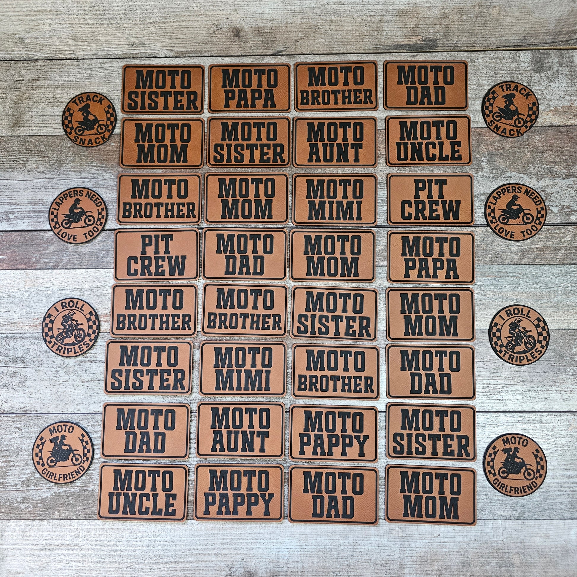 Assorted moto-themed leatherette patches with cowboy-style logos and family titles