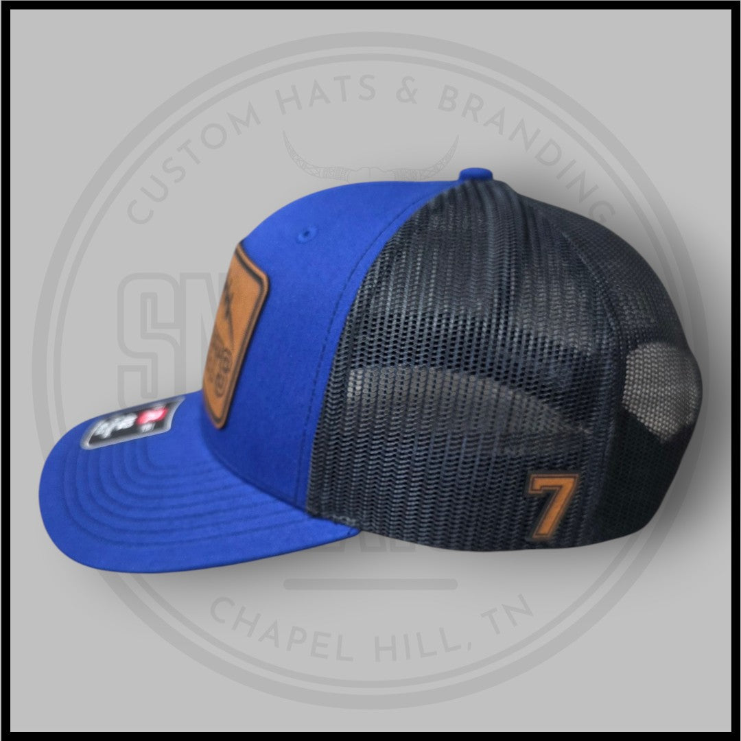 Royal blue and black mesh side cap with Rockets patch and number 7