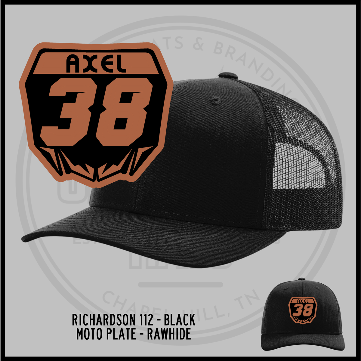 Black trucker baseball cap with mesh back and embroidered 38 badge front