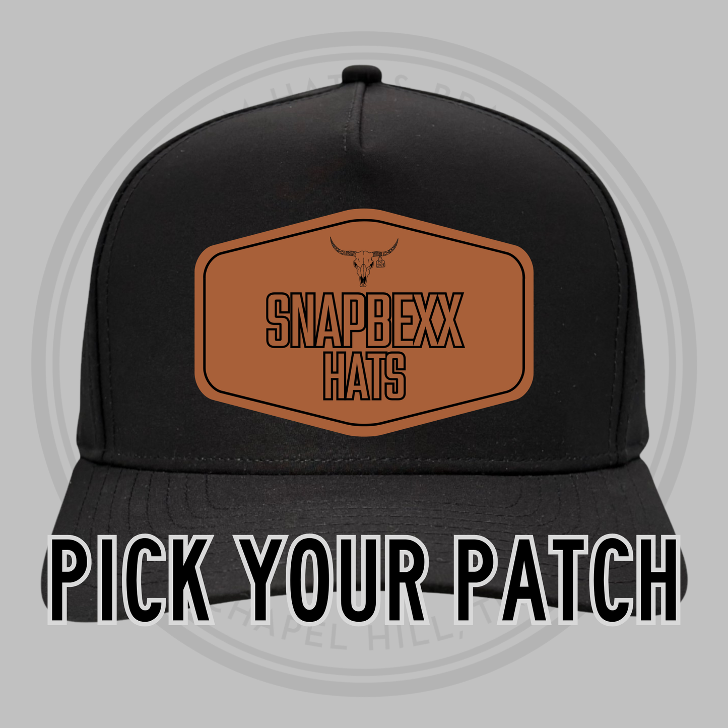 Black baseball cap front with patch area and SNAPDEXX HATS logo