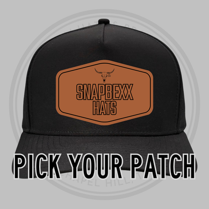 Black baseball cap front with patch area and SNAPDEXX HATS logo