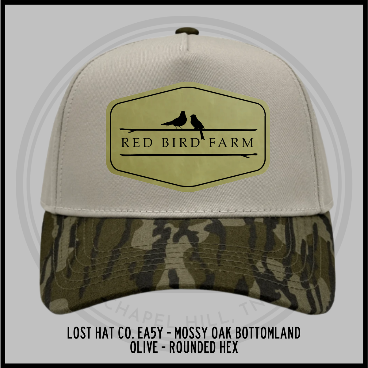 Rounded hex baseball cap with tan crown, olive bottomland camo brim, front patch with bird logo
