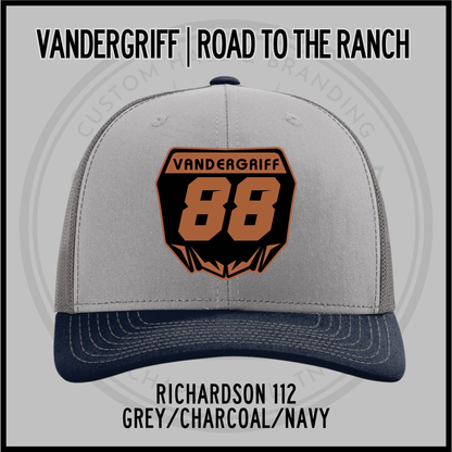 Grey and navy baseball cap with embroidered "Vandergriff 68" patch, charcoal top, navy brim