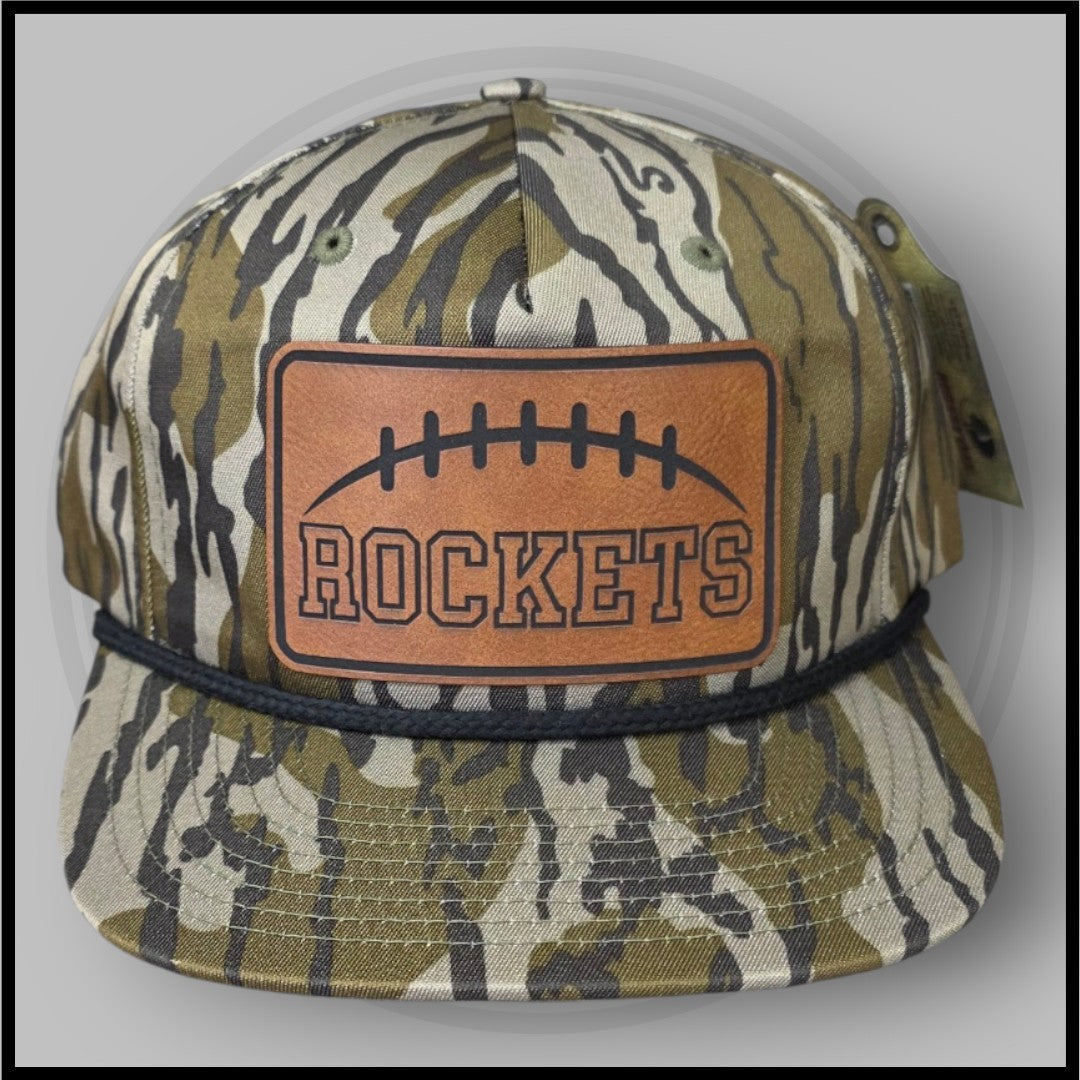 Camo football cap front view with orange Rockets logo patch and stitched football
